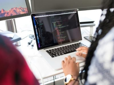 Person Using Silver Macbook Pro